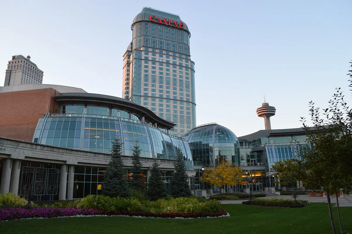 Fallsview Casino Resort in Niagara Falls by day, its glass-domed front and gardens below the hotel tower